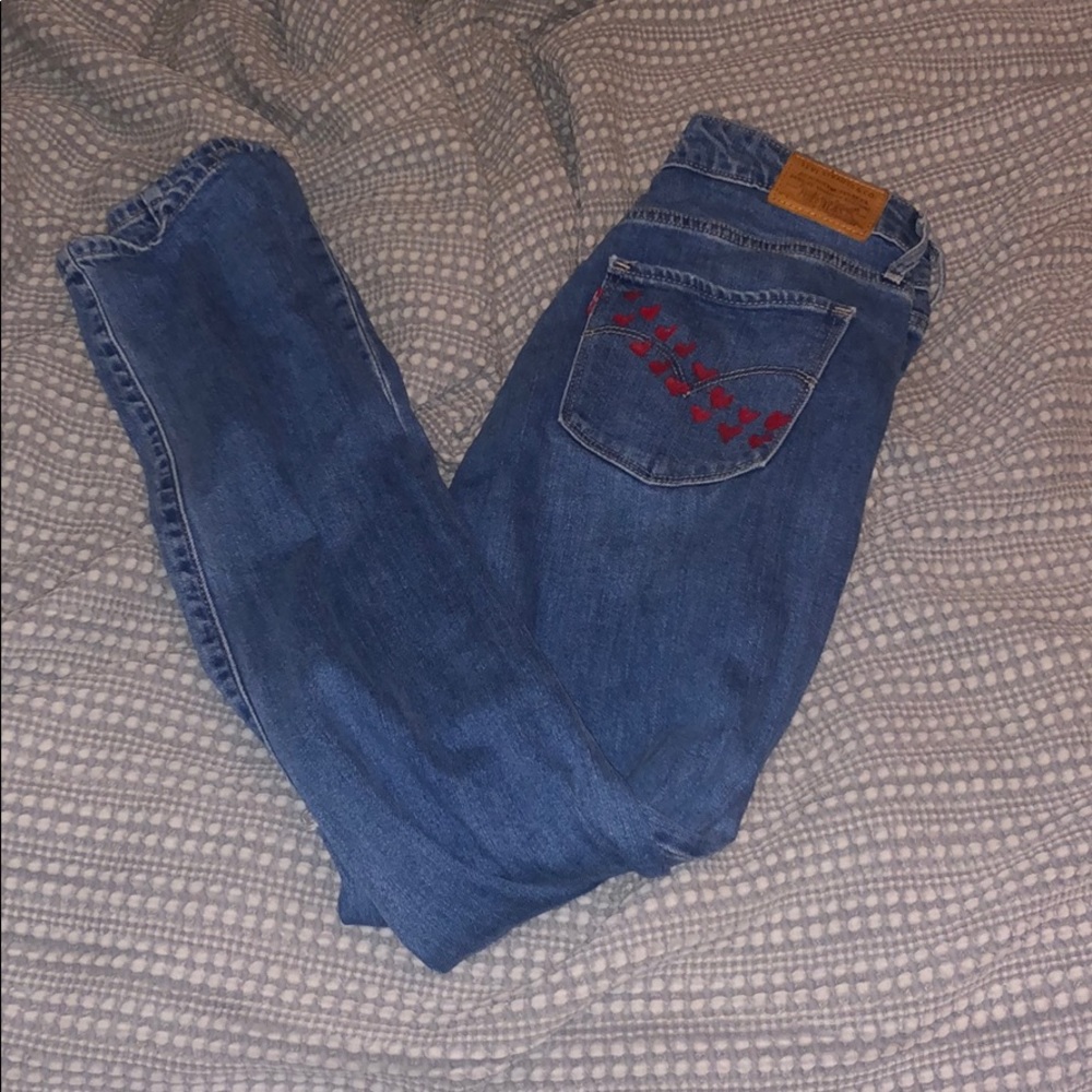 Levi’s jeans with painted pocket and knees cut out